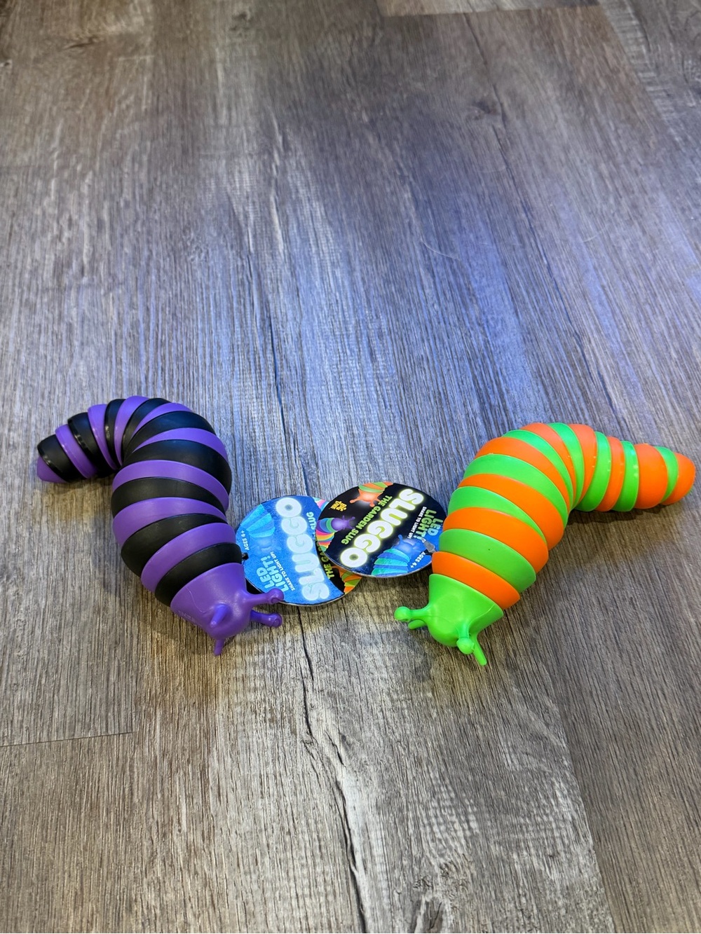 Slug fidget Toys - Purple/Black & Green/Orange